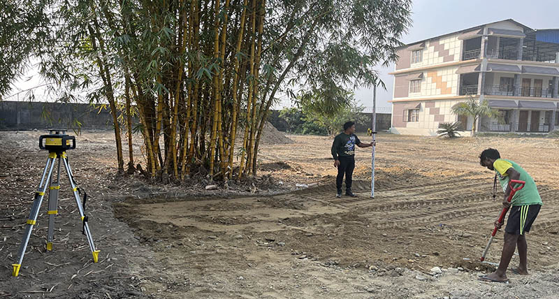 men working with a laser